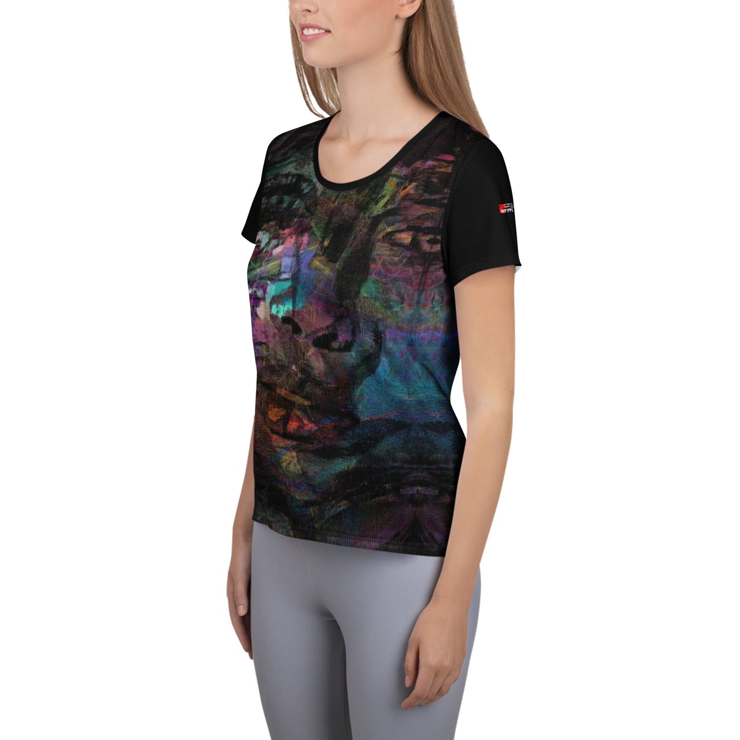 A woman in a vibrant Hipyfi Chromatic Dreams Athletic Tee. The artistic pattern blends, while the lightweight and performance-ready fit. left-6
