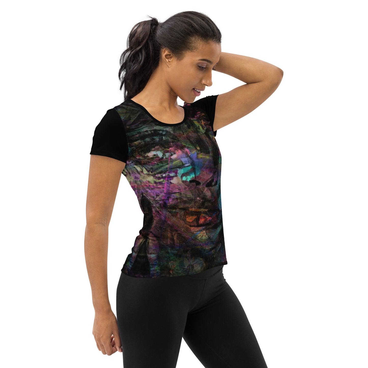 A woman in a vibrant Hipyfi Chromatic Dreams Athletic Tee. The artistic pattern blends, while the lightweight and performance-ready fit. right