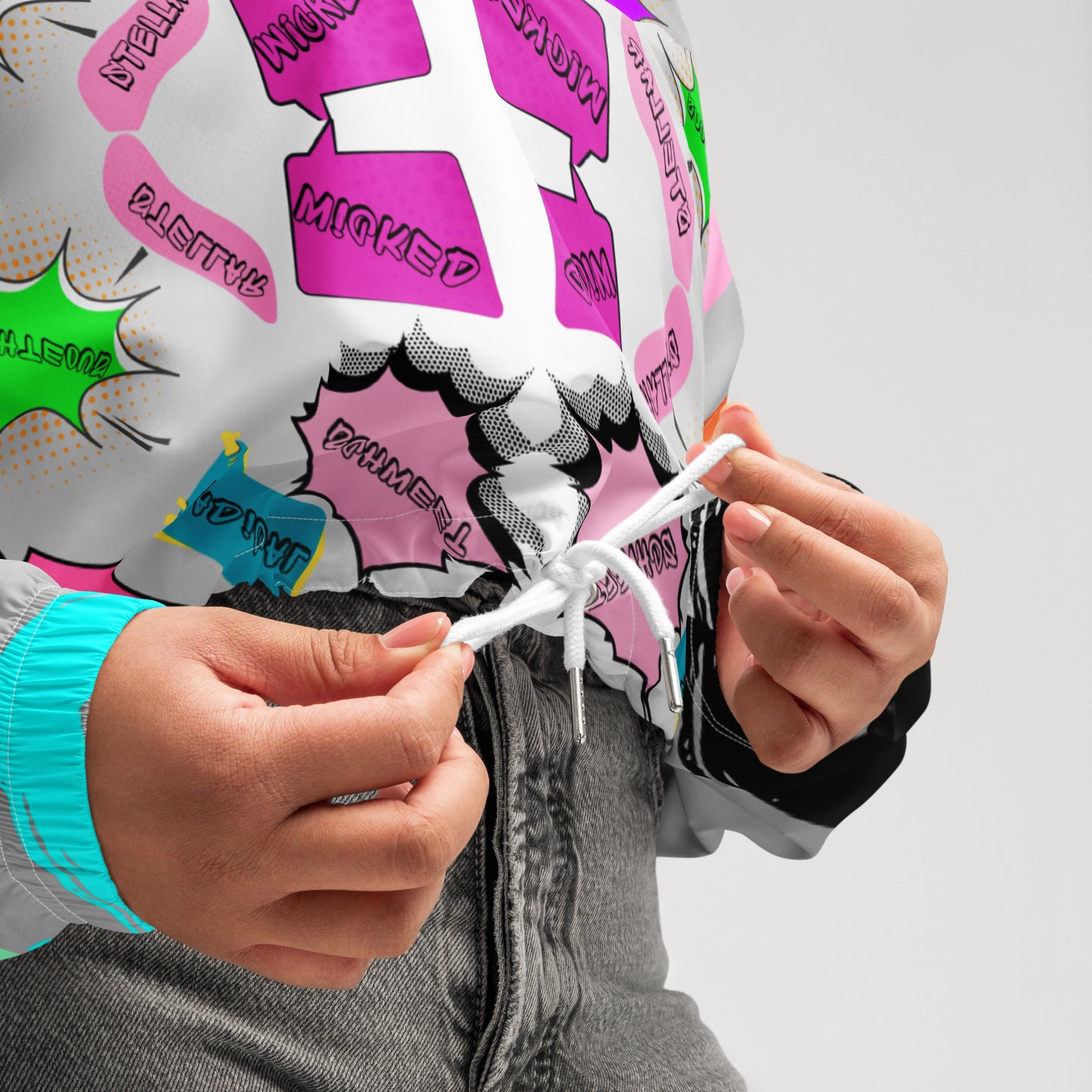 Hipyfi Women’s Retro 80s Graphic Print Cropped Windbreaker with bold neon comic-book slang, retro-futuristic geometric patterns, and contrasting vibrant sleeves. white-product-details-2