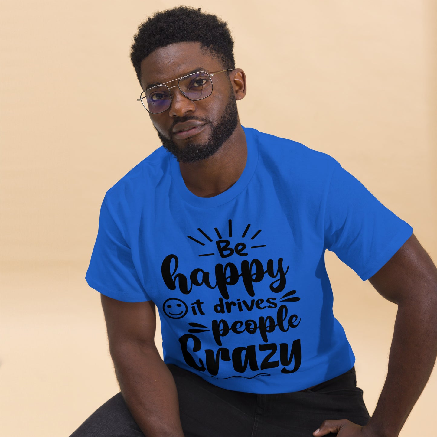 Unisex inspirational t-shirt with “Be Happy, It Drives People Crazy” quote in bold typography – Hipyfi Clothes & Design graphic tee. royal-front
