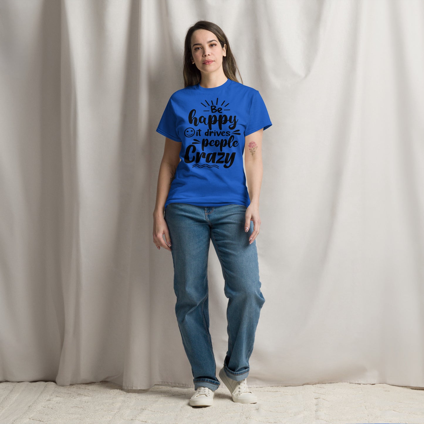 Unisex inspirational t-shirt with “Be Happy, It Drives People Crazy” quote in bold typography – Hipyfi Clothes & Design graphic tee. royal-front-2