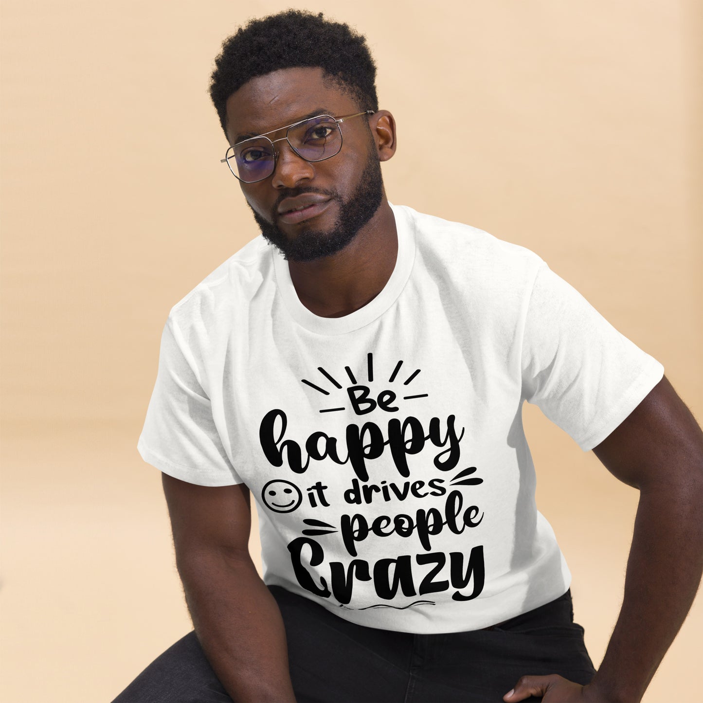 Unisex inspirational t-shirt with “Be Happy, It Drives People Crazy” quote in bold typography – Hipyfi Clothes & Design graphic tee. white-front