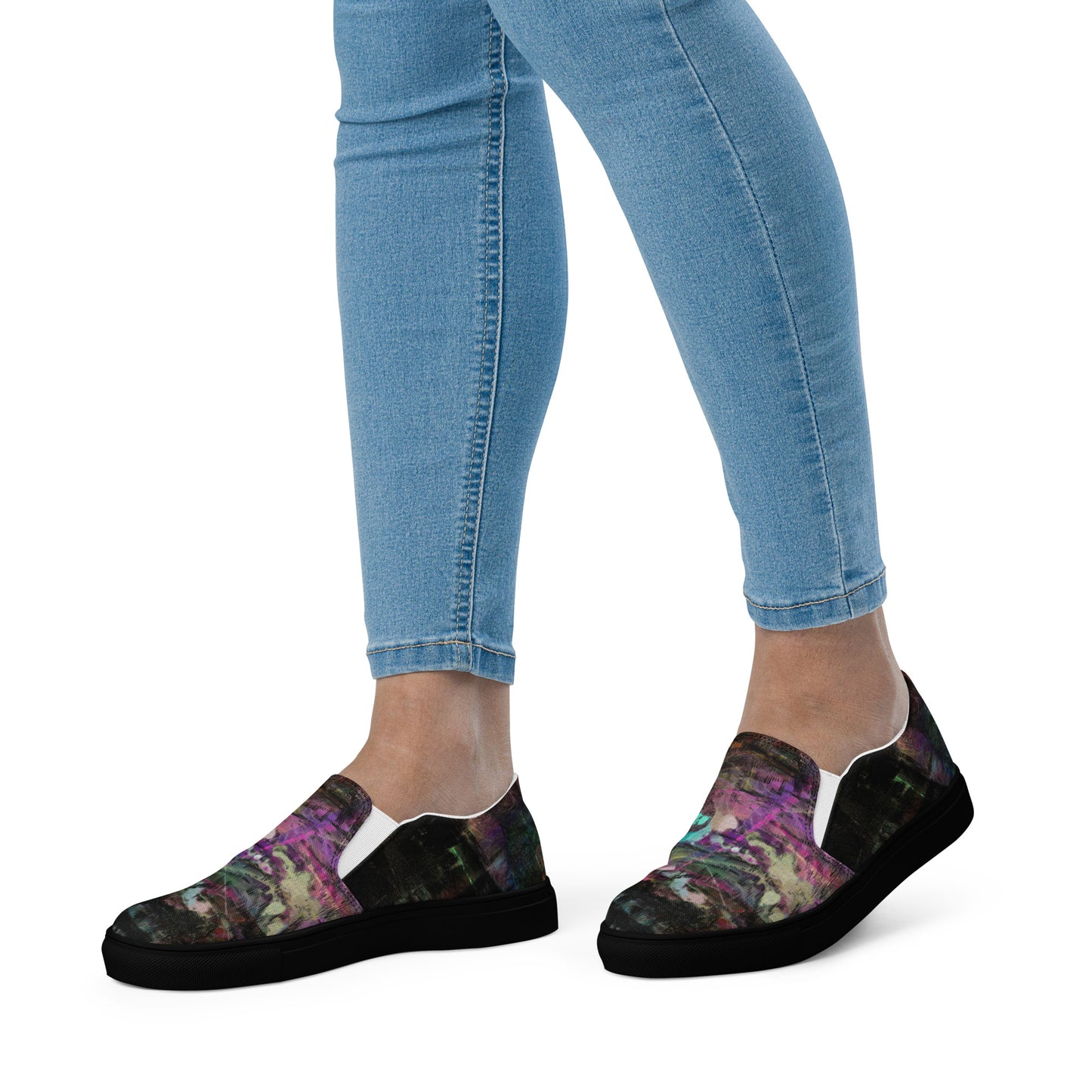 Close-up of Hipyfi Women’s Chromatic Dreams slip-on sneakers, showcasing a modern abstract face design with multicolor, elastic side accents, and a cushioned sole for comfort. black-front-3