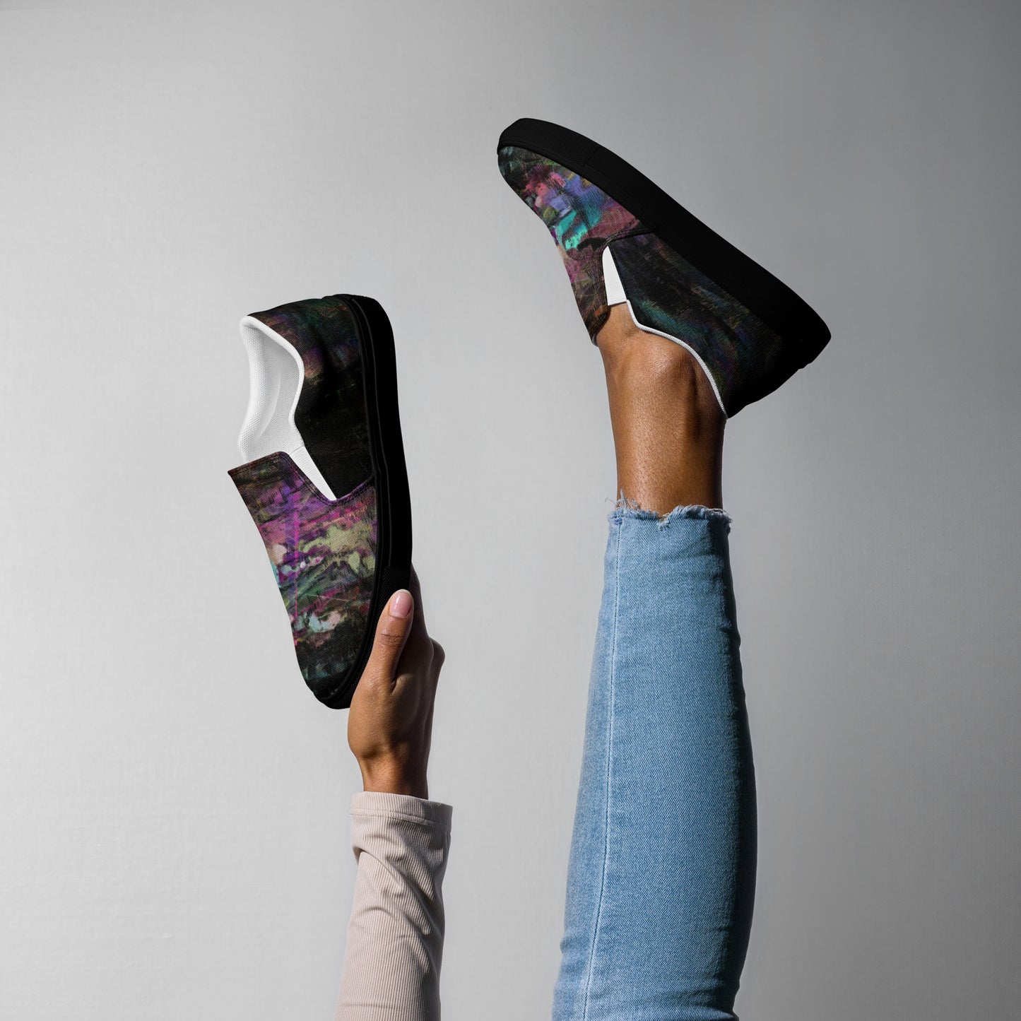 Close-up of Hipyfi Women’s Chromatic Dreams slip-on sneakers, showcasing a modern abstract face design with multicolor, elastic side accents, and a cushioned sole for comfort. black-right