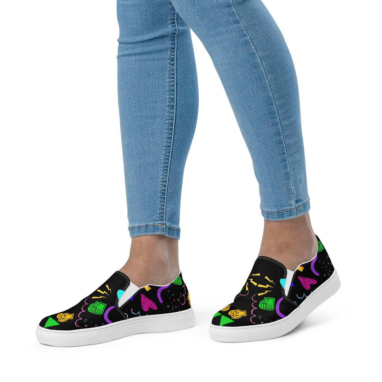 Women's Retro Canvas Slip-On Sneakers with vibrant 80s Memphis-style abstract pattern on black background – stylish, lightweight, and eco-friendly casual shoes by Hipyfi Clothes & Design. white-front-3