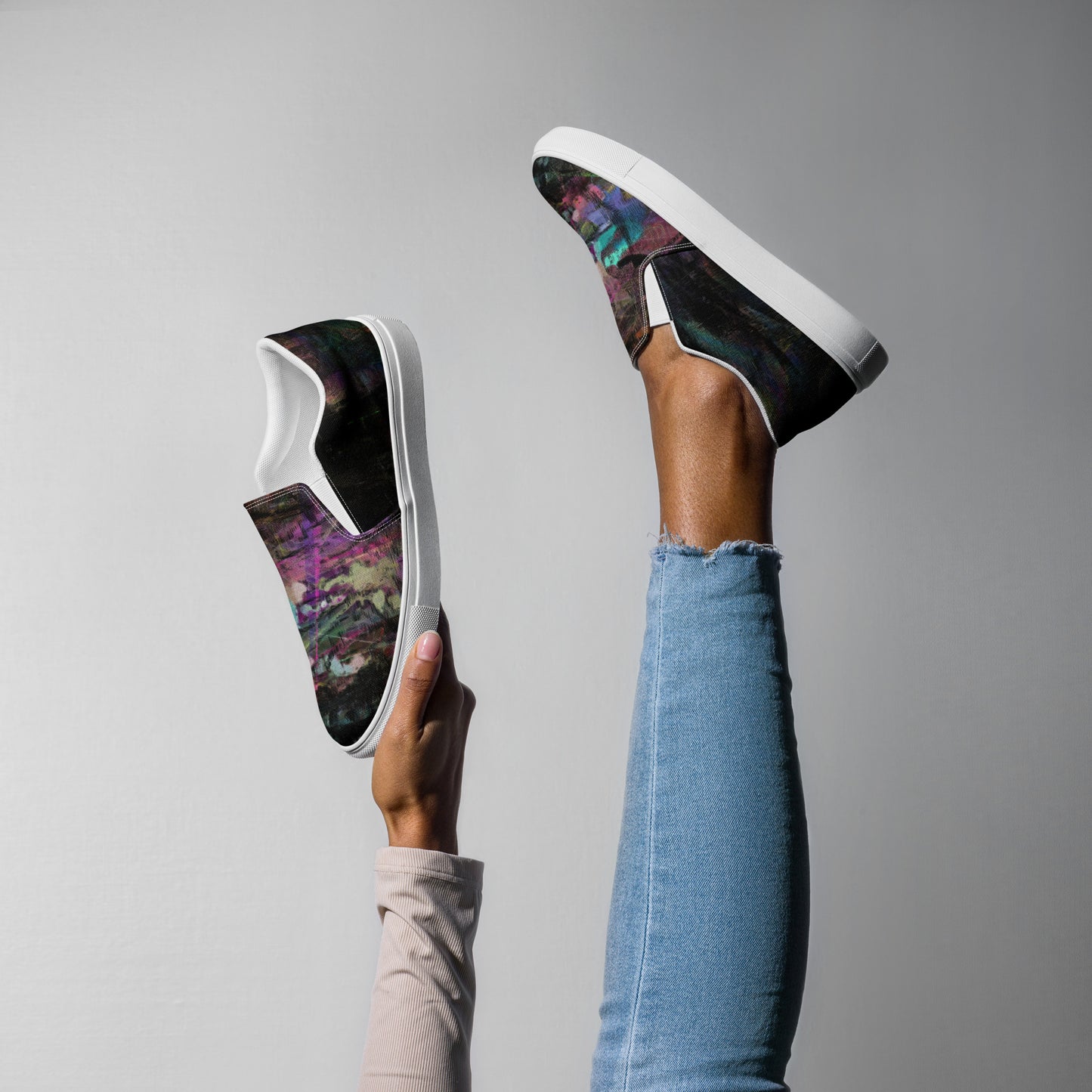 Close-up of Hipyfi Women’s Chromatic Dreams slip-on sneakers, showcasing a modern abstract face design with multicolor, elastic side accents, and a cushioned sole for comfort. white-right
