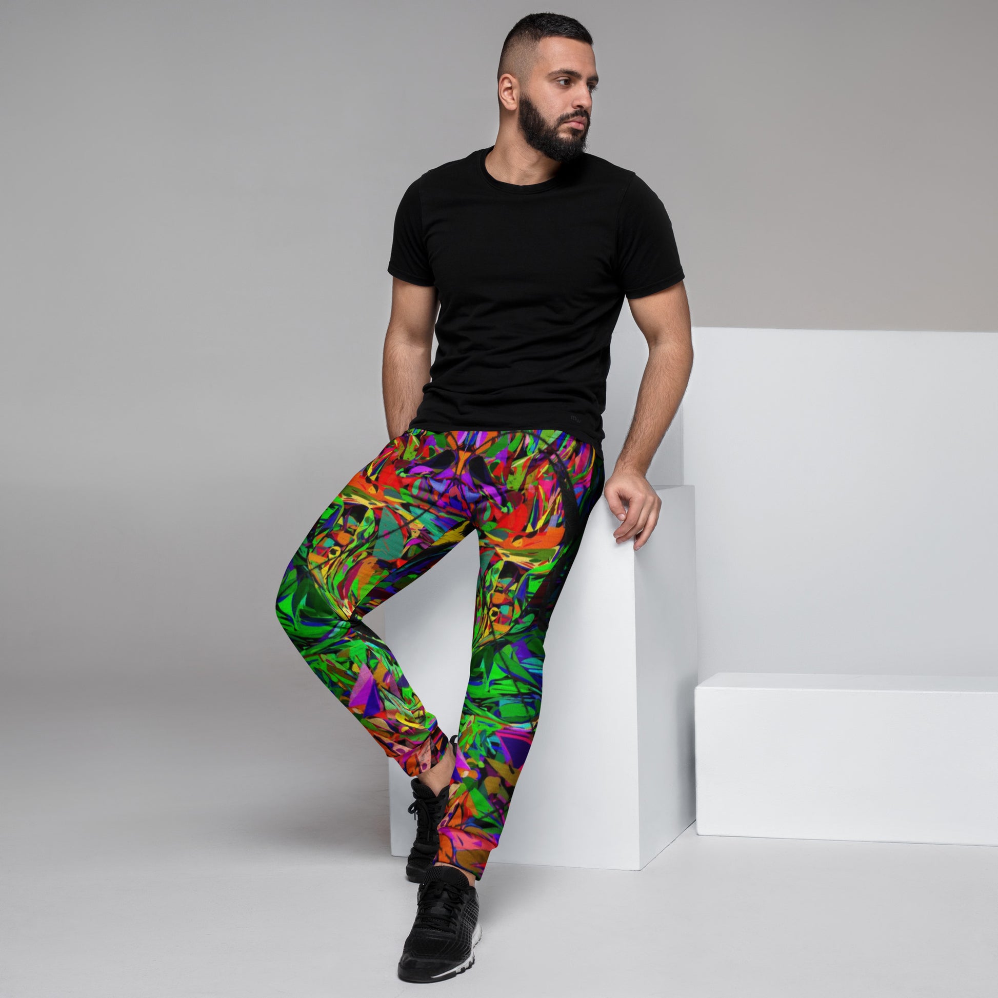 Neon Mythos Abstract Joggers for Men – Colorful, eco-friendly recycled streetwear with slim fit and vibrant graphic design by Hipyfi Clothes & Design. Left