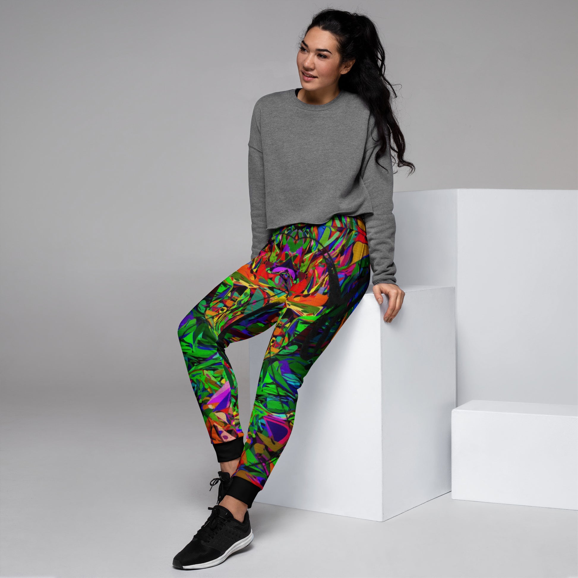 Eco-friendly women’s joggers with vibrant abstract neon print – Neon Mythos design by Hipyfi Clothes & Design Left