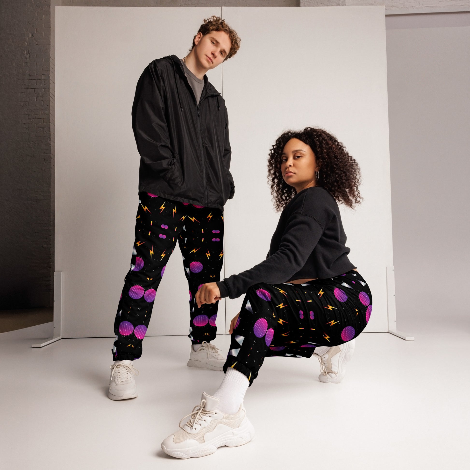 Hipyfi Synthwave Unisex Track Pants with retro geometric neon 80s design – streetwear joggers for men and women.  front