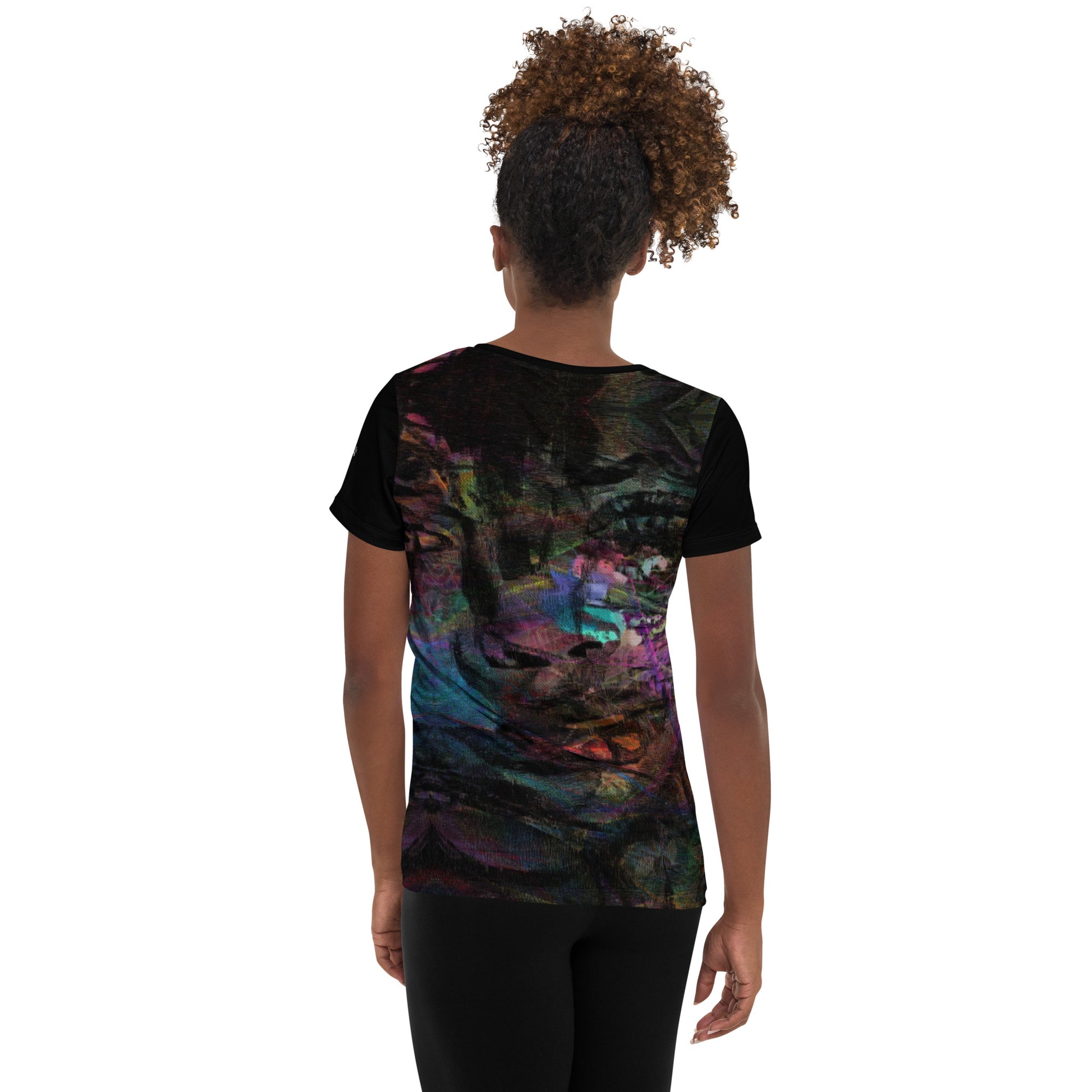 A woman in a vibrant Hipyfi Chromatic Dreams Athletic Tee. The artistic pattern blends, while the lightweight and performance-ready fit. back-2