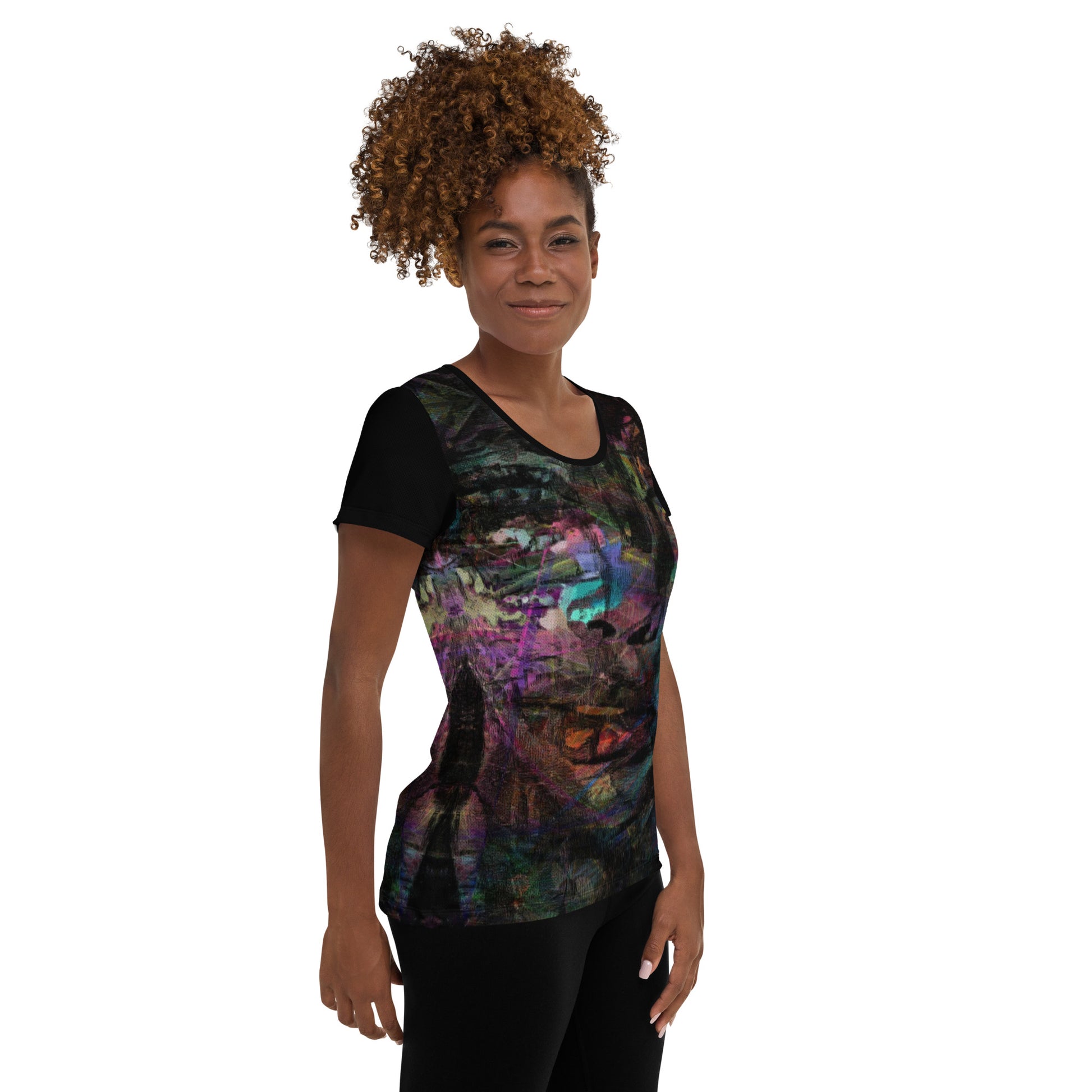 A woman in a vibrant Hipyfi Chromatic Dreams Athletic Tee. The artistic pattern blends, while the lightweight and performance-ready fit. right-2