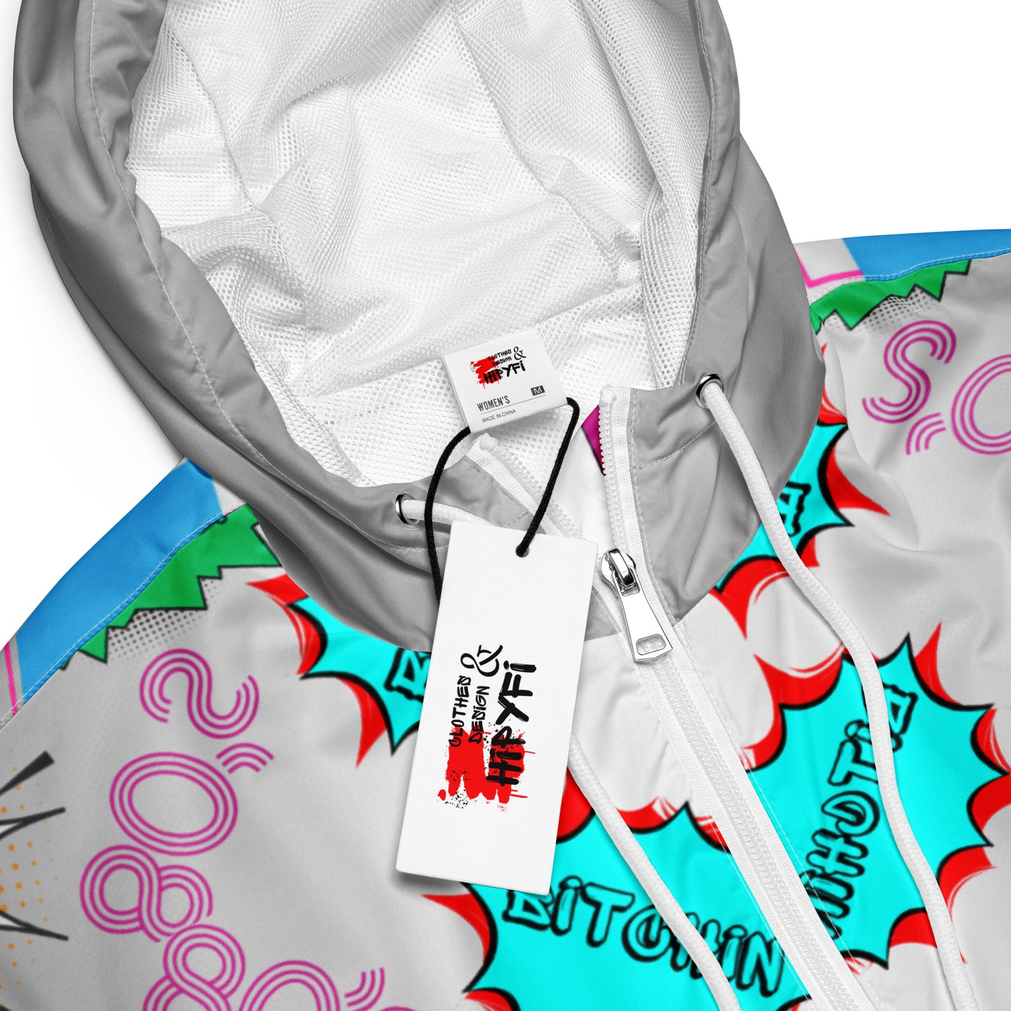 Hipyfi Women’s Retro 80s Graphic Print Cropped Windbreaker with bold neon comic-book slang, retro-futuristic geometric patterns, and contrasting vibrant sleeves. white-product-details--2