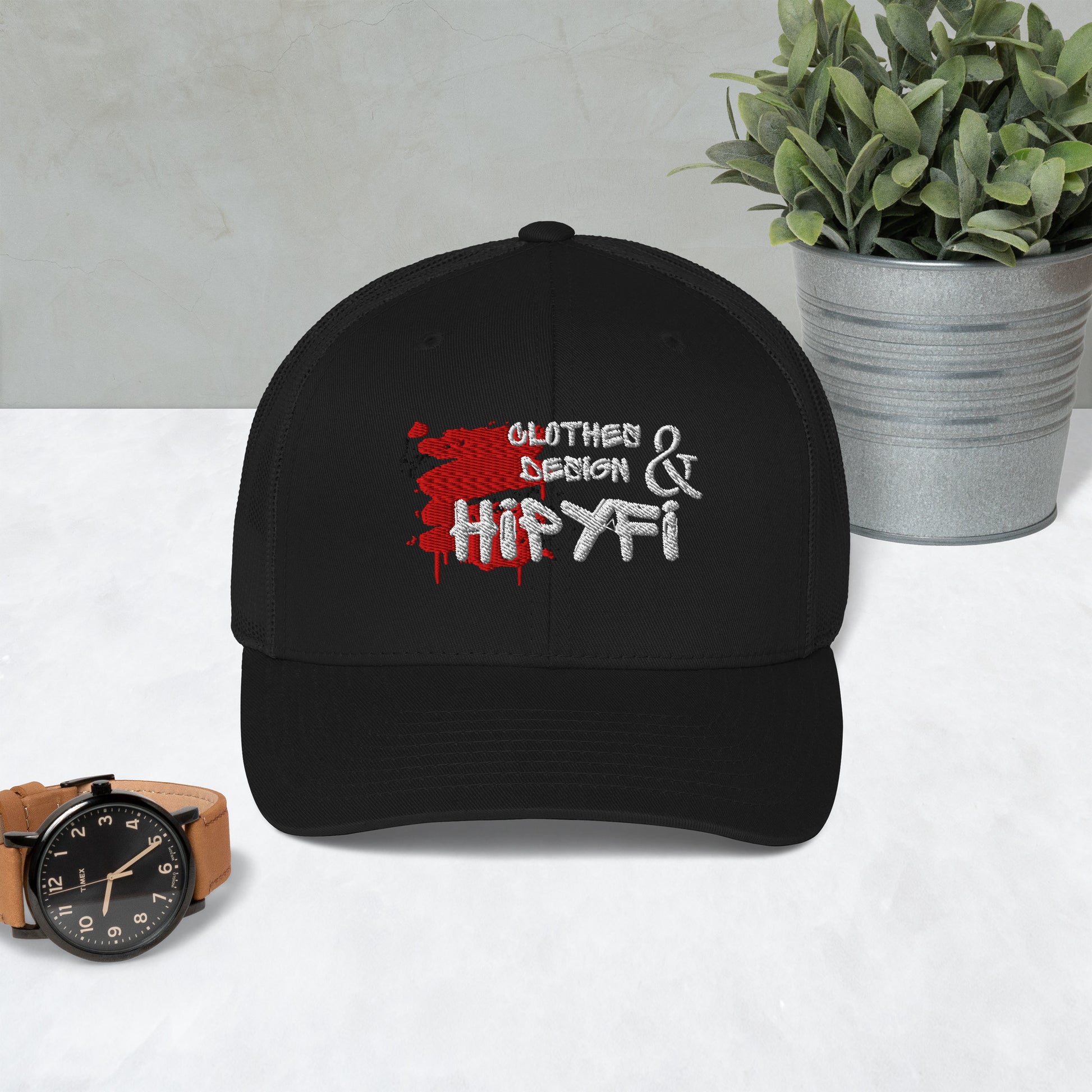 Black Hipyfi Classic Logo Trucker Cap with embroidered front, mesh back, and adjustable snapback closure. Front-2