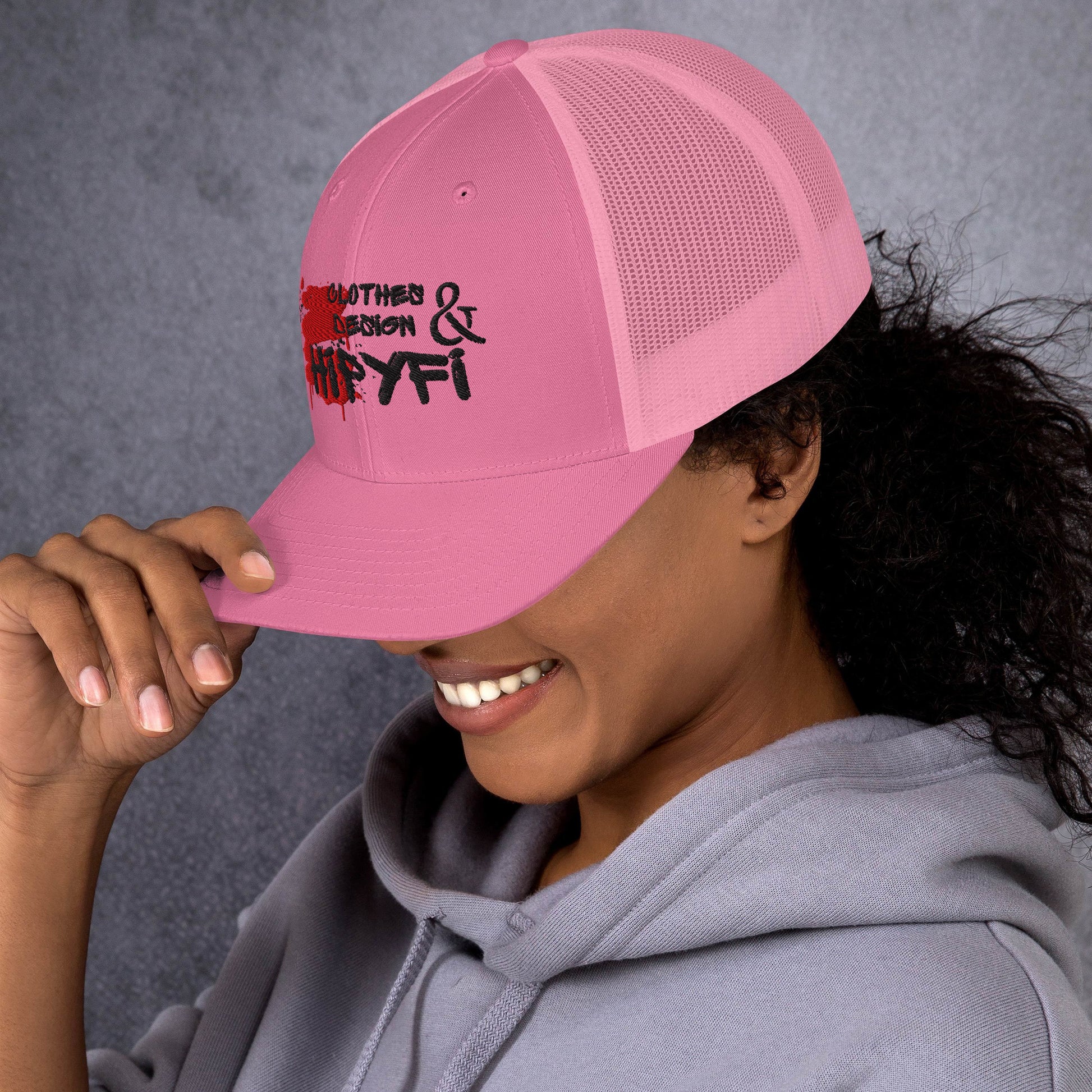 Pink retro trucker hat with mesh back and Hipyfi logo, adjustable snapback cap for men and women. Left