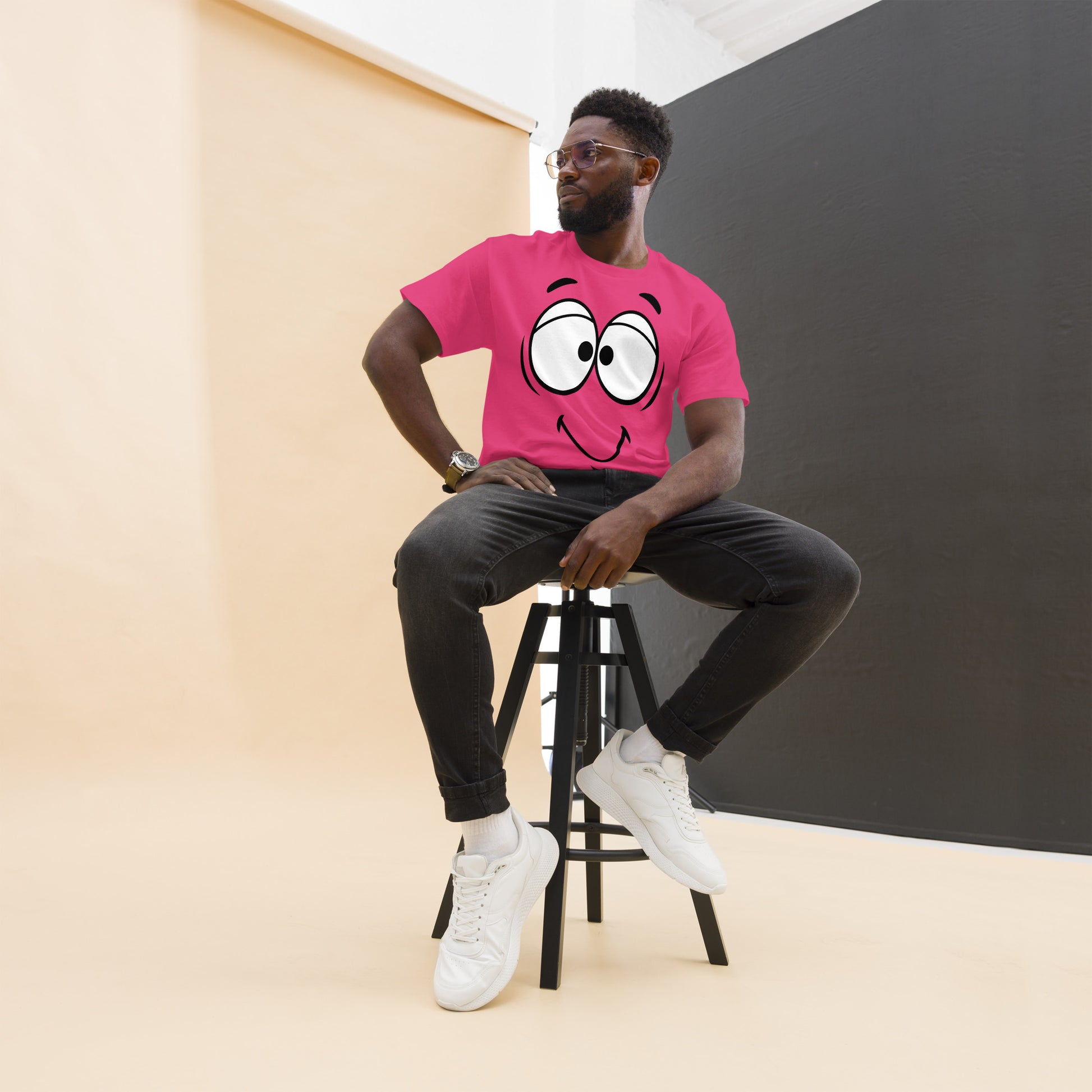 Unisex minimalist cartoon face t-shirt with bold black line art and playful smile – Hipyfi Clothes & Design. heliconia-front