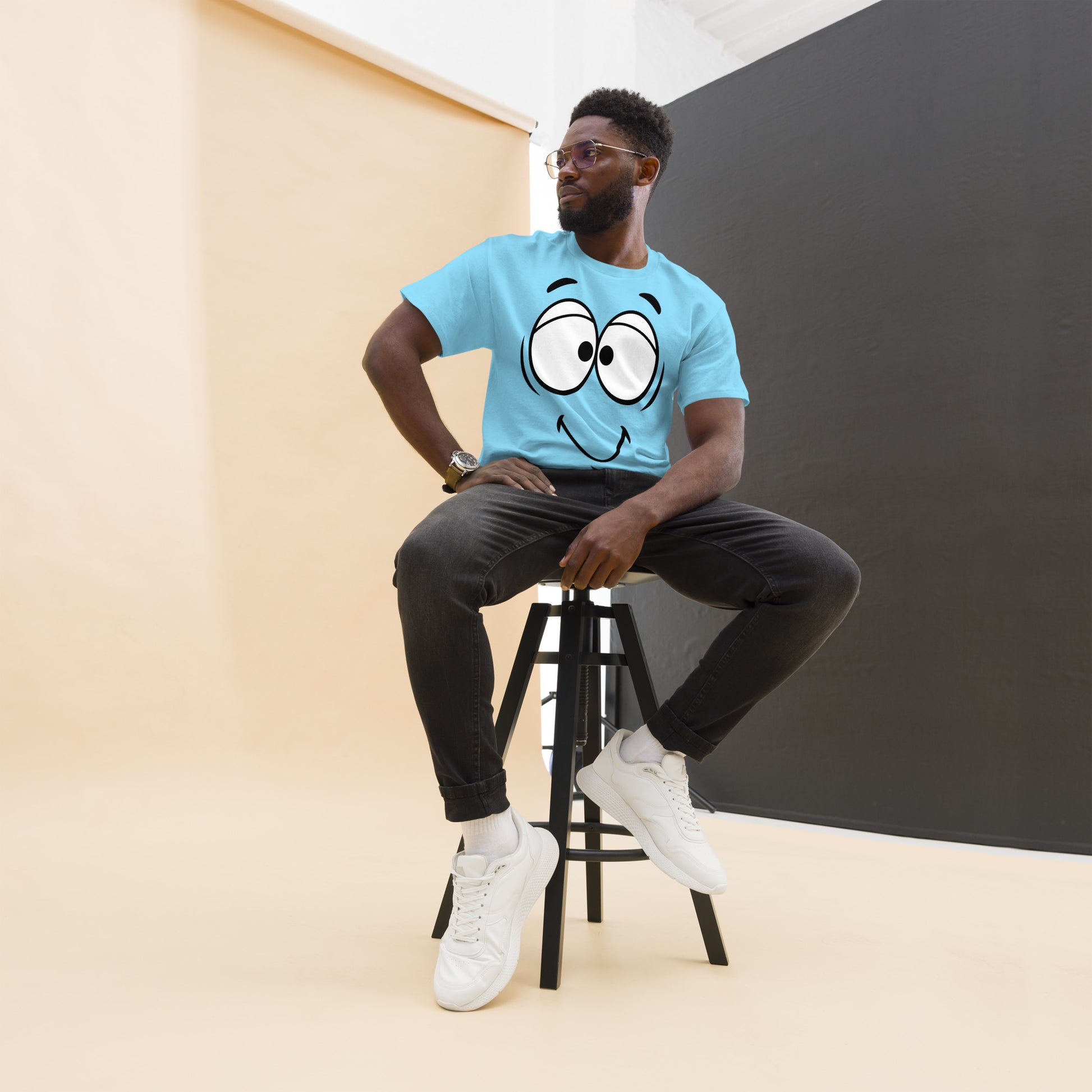 Unisex minimalist cartoon face t-shirt with bold black line art and playful smile – Hipyfi Clothes & Design. sky-front