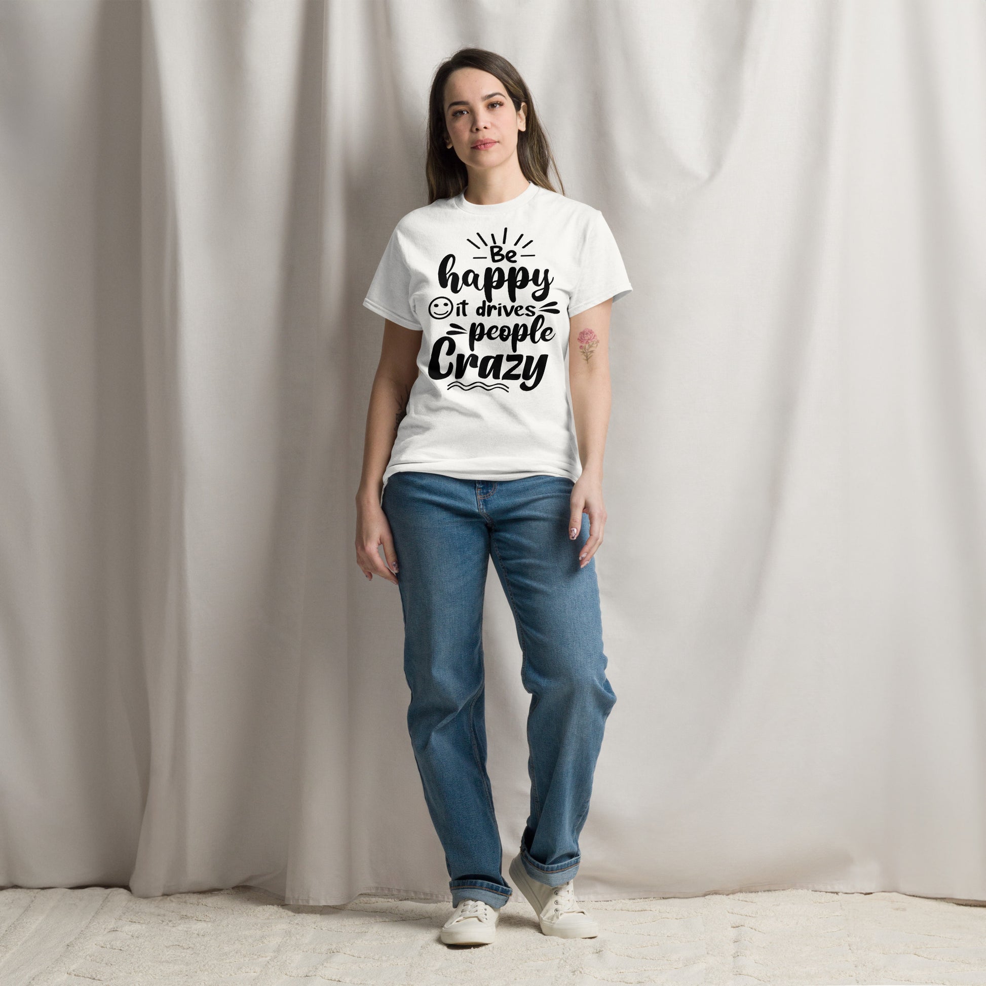 Unisex inspirational t-shirt with “Be Happy, It Drives People Crazy” quote in bold typography – Hipyfi Clothes & Design graphic tee. white-front-2