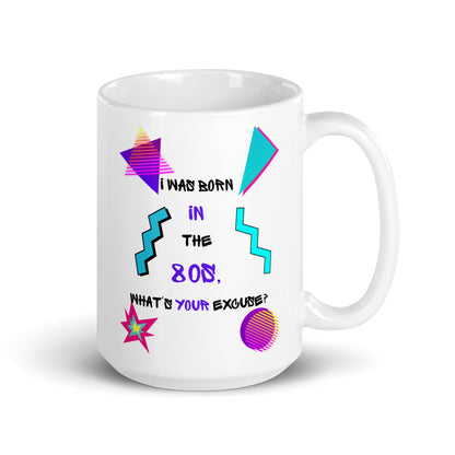 Retro 80s ceramic mug with neon geometric patterns and “I Was Born In The 80s, What’s Your Excuse?” hand-drawn typography by Hipyfi Clothes & Design 15-oz-handle-on-right