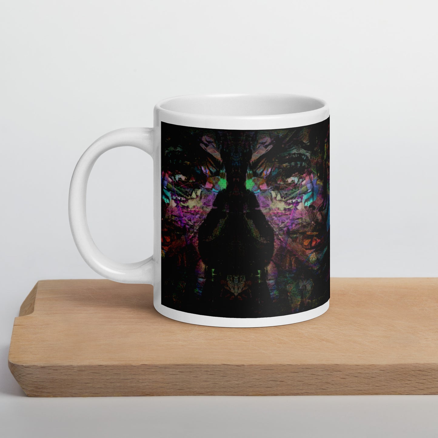 Hipyfi Chromatic Dreams Ceramic Mug with abstract vibrant design on a glossy white surface. Held in hand, unisex, dishwasher-safe. 20-oz
