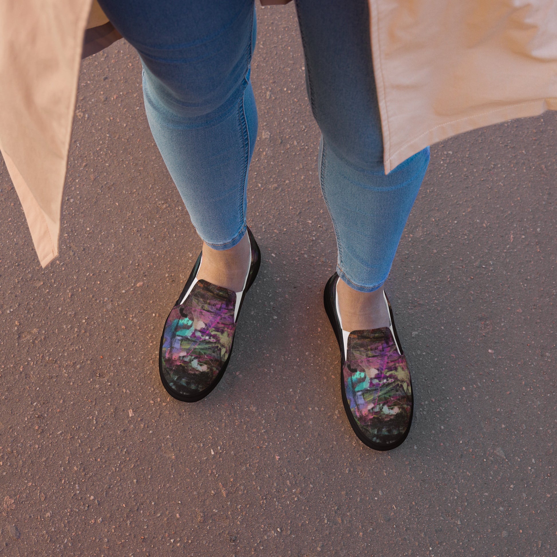 Close-up of Hipyfi Women’s Chromatic Dreams slip-on sneakers, showcasing a modern abstract face design with multicolor, elastic side accents, and a cushioned sole for comfort. black-front-2