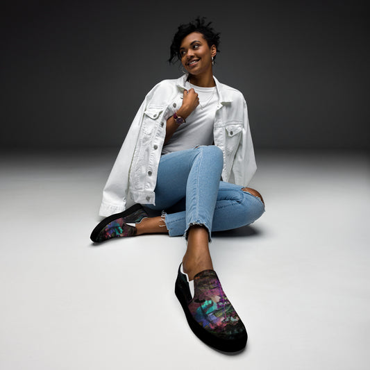 Close-up of Hipyfi Women’s Chromatic Dreams slip-on sneakers, showcasing a modern abstract face design with multicolor, elastic side accents, and a cushioned sole for comfort. black-front