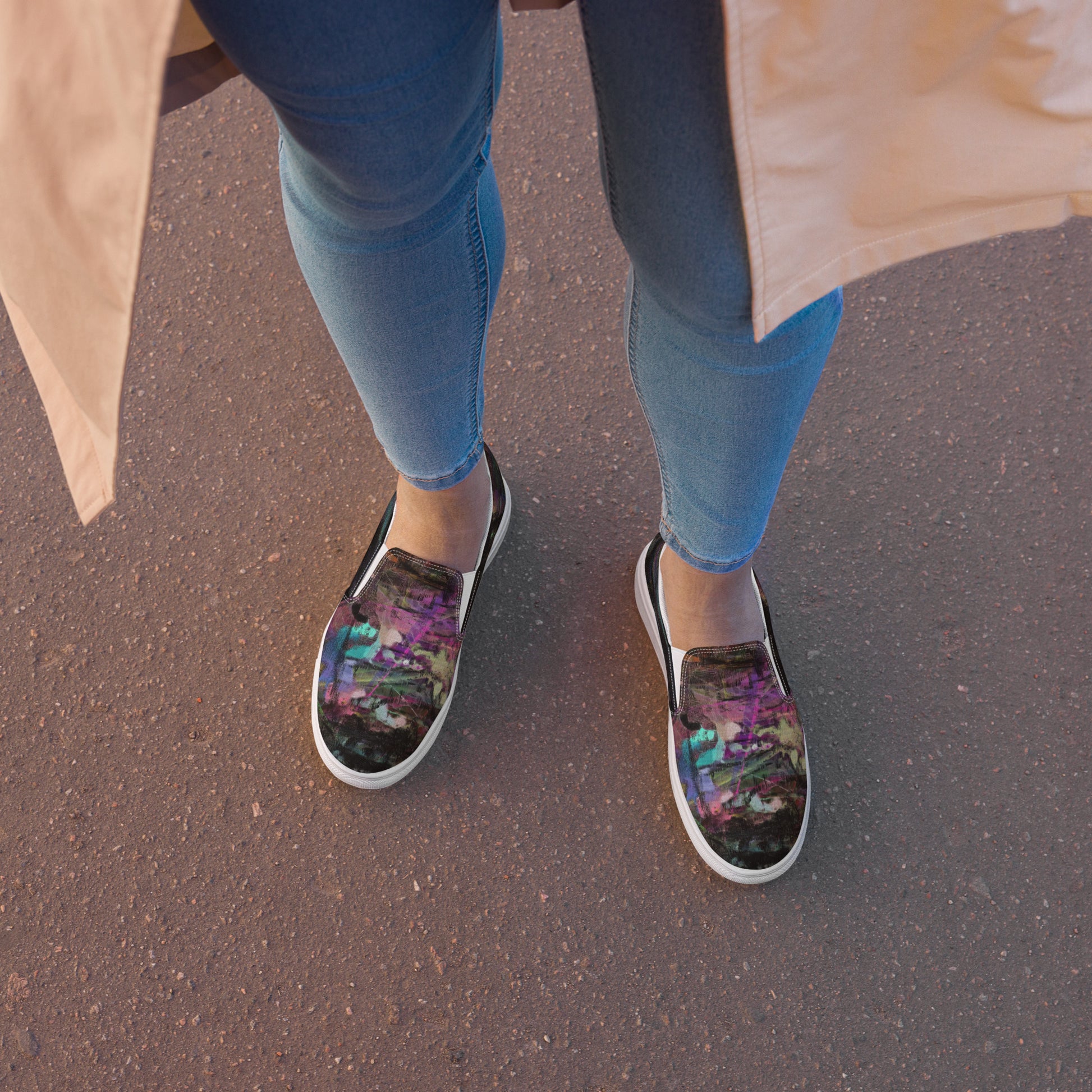 Close-up of Hipyfi Women’s Chromatic Dreams slip-on sneakers, showcasing a modern abstract face design with multicolor, elastic side accents, and a cushioned sole for comfort. white-front-2