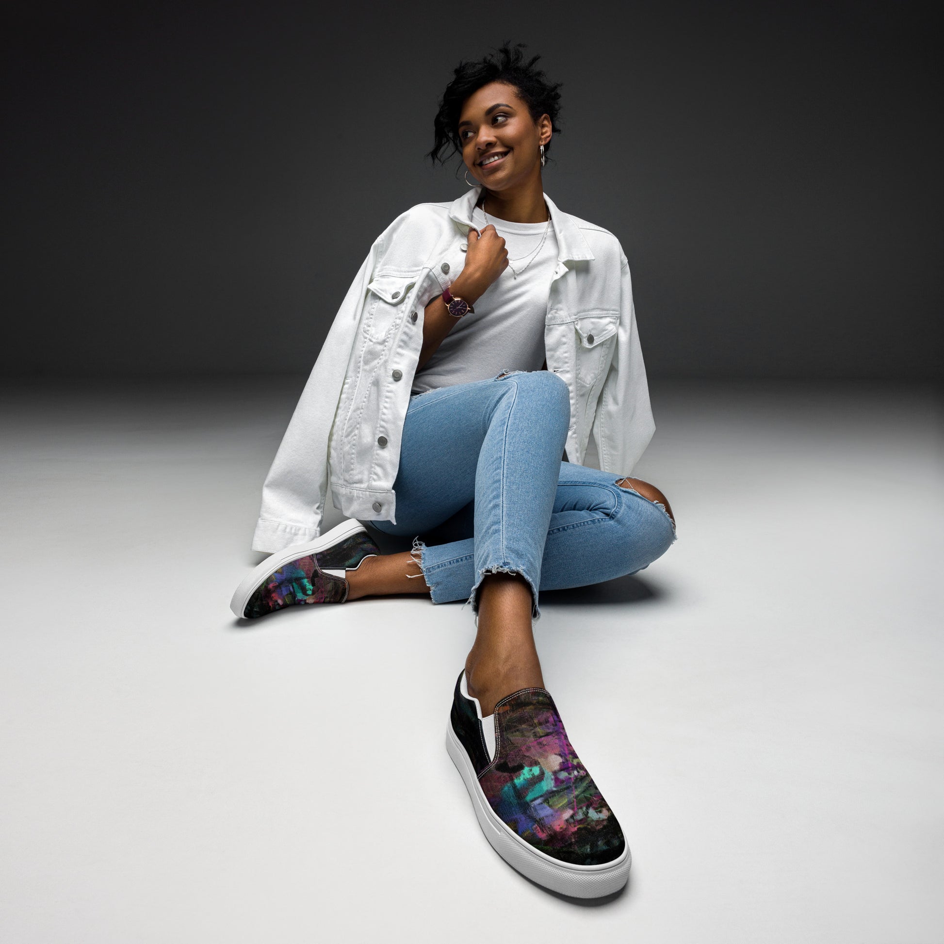 Close-up of Hipyfi Women’s Chromatic Dreams slip-on sneakers, showcasing a modern abstract face design with multicolor, elastic side accents, and a cushioned sole for comfort. white-front
